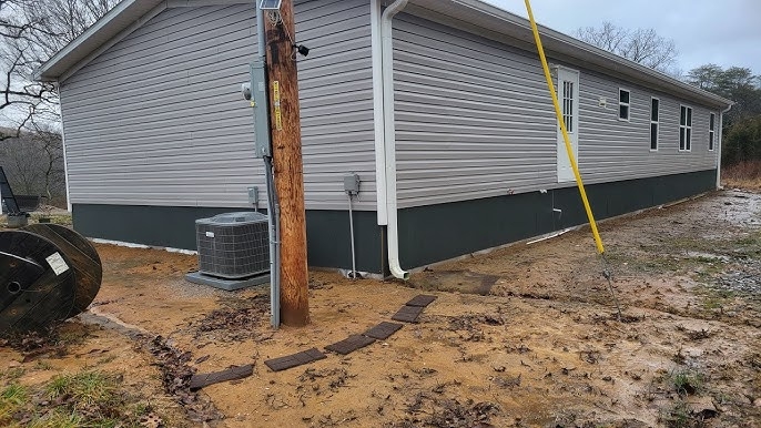 Solid Panel Mobile Home Skirting: Dark Grey Fiber Cement Look.