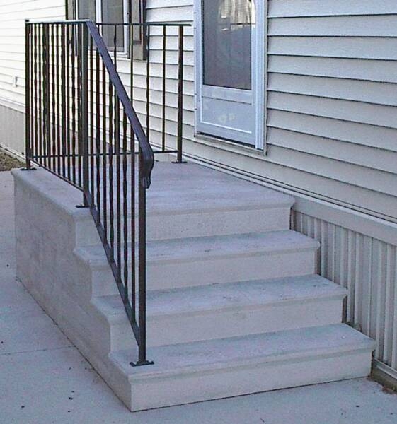 Stairs, Integrated Porch Landing with Black Metal Railing.