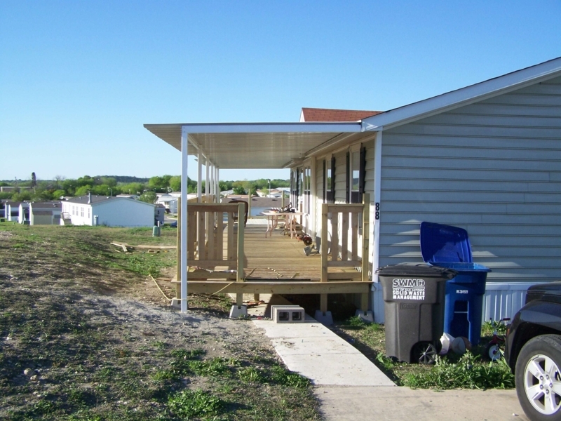 Stationary Awning over Wooden Deck with Integrated Railing