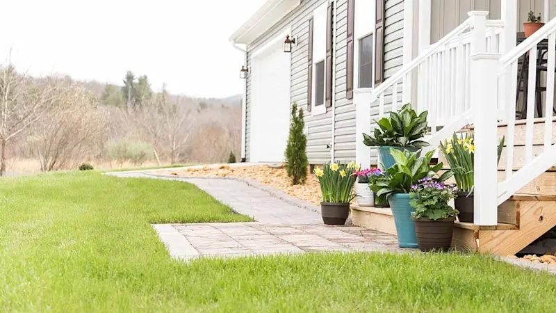 Stone Paver Walkway & Mixed Potted Plants in Residential Front Yard