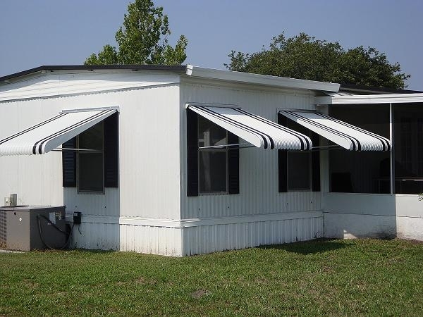 Striped Clamshell Window Awning with Black Accent