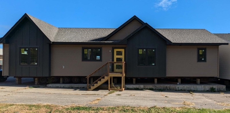 Tan and Charcoal House Siding with Vibrant Yellow Front Door Accent