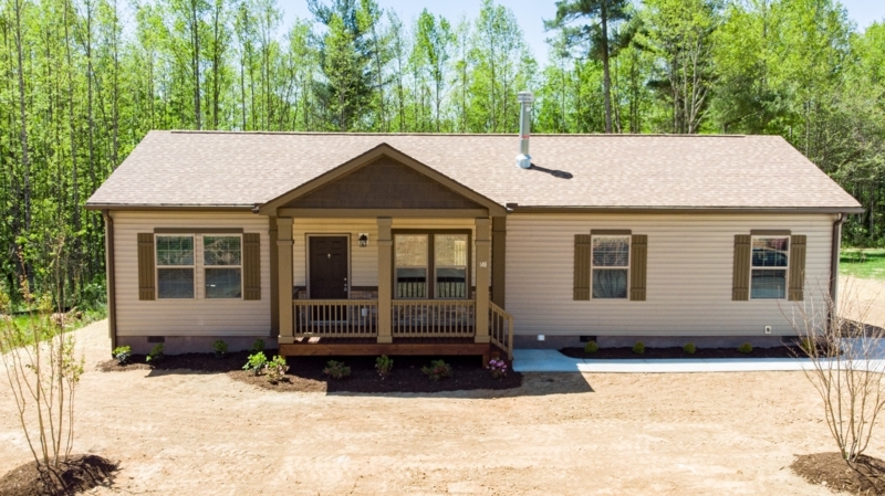 Tan Manufactured Home With Dark Brown Trim | Gabled Porch Design