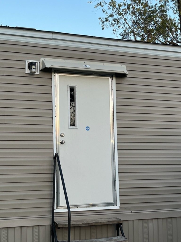Tan Molded Door Hood Awning with Water Diversion System and Slanted Top