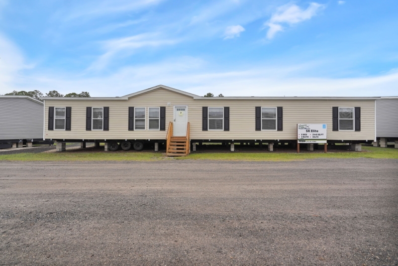Tan Siding Double Wide with Gabled Entryway