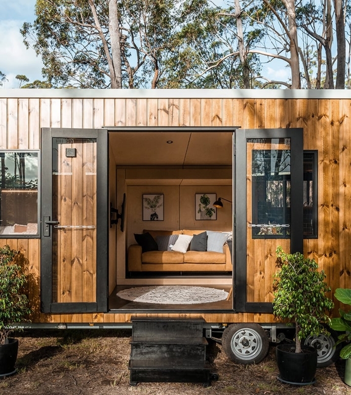 Tiny House Exterior: Modern Vertical Wood Siding and Black Door Frames