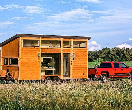 Tiny House on a Mobile Foundation with Expansive Glazing.