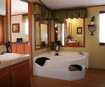 Traditional Bathroom: Corner Bathtub Layout with Wrap Around Mirrors