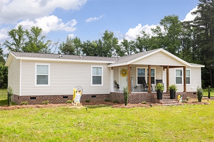 Traditional Manufactured Home: Brick Skirting & Covered Porch