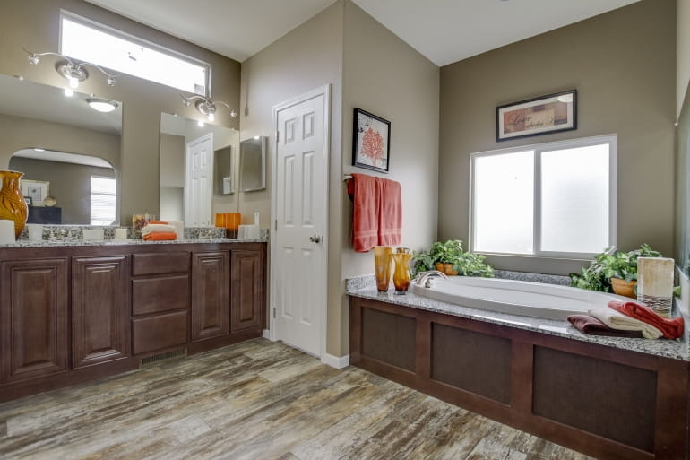 Transitional Bathroom Design: Dark Wood Cabinetry and Soaking Tub