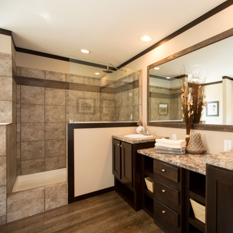 Transitional Bathroom featuring Dark Wood Vanity and Earthy Tile