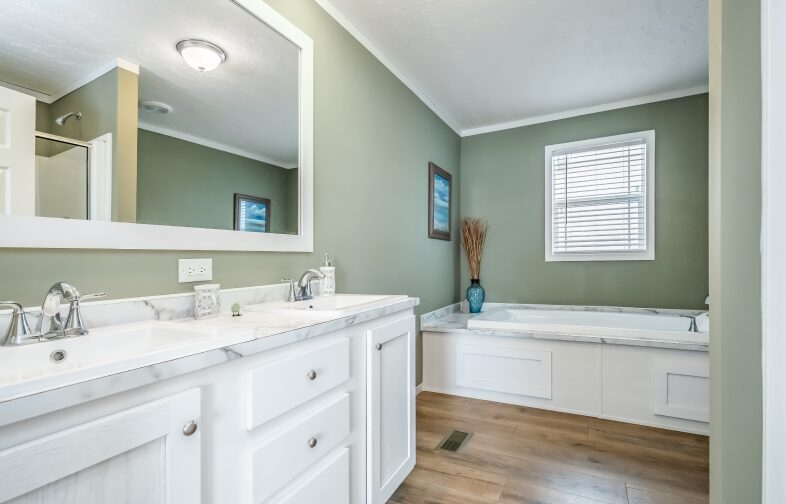Transitional Bathroom with Sage Green Walls and Marble Look Surround