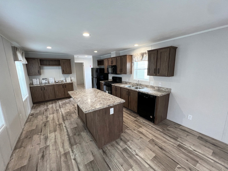 Transitional Kitchen with Marbled Countertops and Black Appliance Suite
