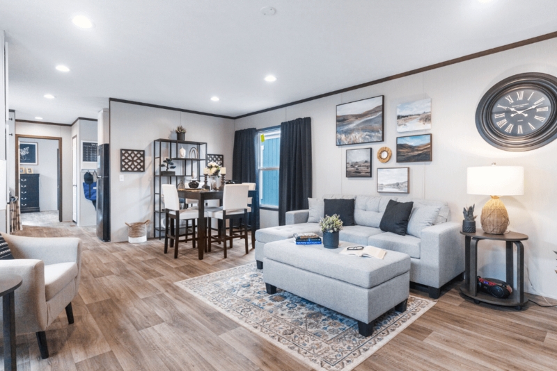 Transitional Living Room with Gallery Wall Layout and Oversized Clock