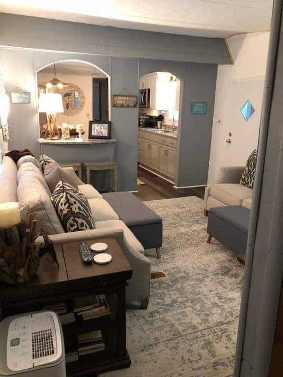 Transitional Living Room with Sectional Sofa and Arched Wall Cutout