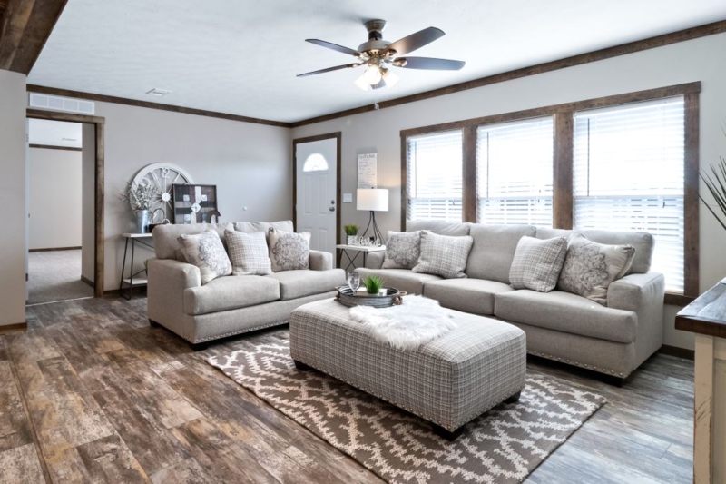 Transitional Seating Area with Oversized Plaid Ottoman and Dark Wood Trim
