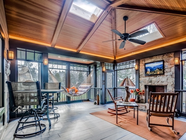 Two Large Skylights: Rustic Outdoor Living Room, Stone Fireplace