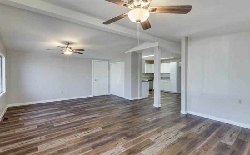 Variegated Wood Grain Laminate Flooring in Open Concept Mobile Home