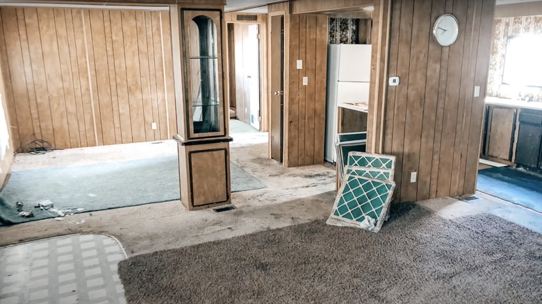 Vintage Mobile Home Living Room layout with Vertical Wood Paneling