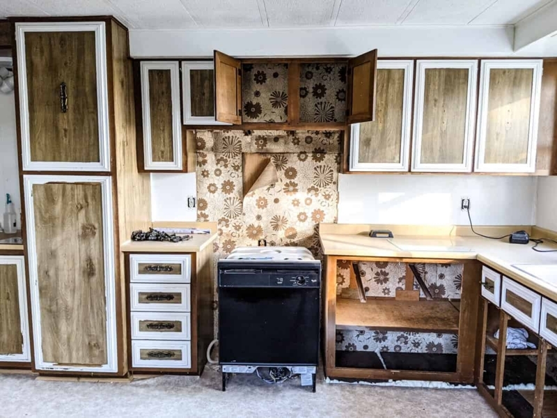 Vintage Style Cabinets with White Trim and Floral Wallpaper