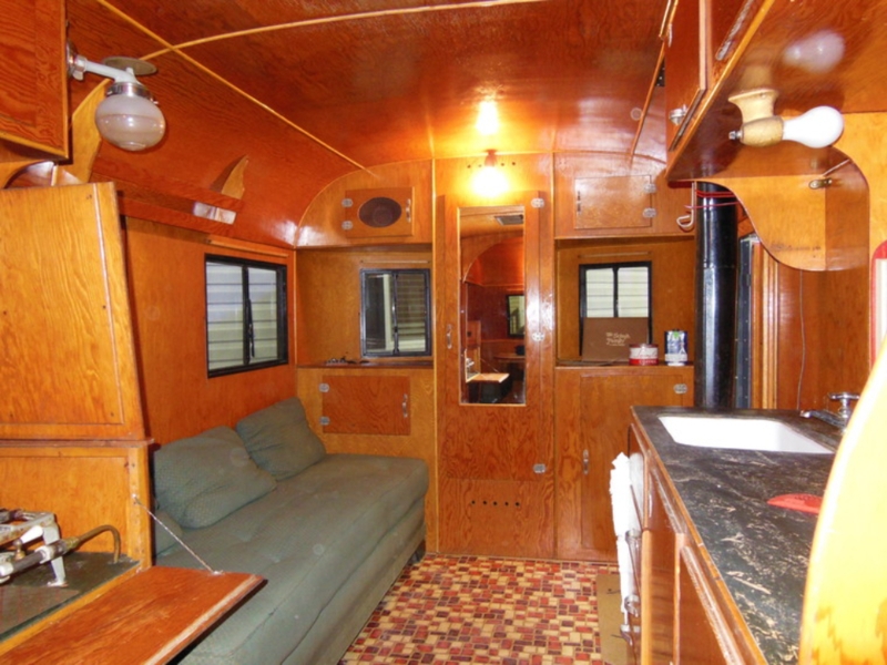 Vintage Trailer Interior with All Wood Paneling and Arched Ceiling