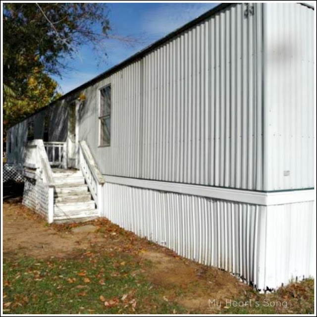 White Corrugated Metal Siding and Lattice Skirting