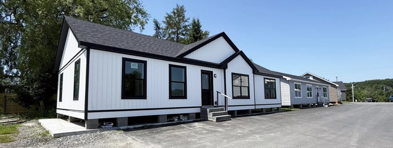 White Manufactured Home Exterior featuring High Contrast Black Trim
