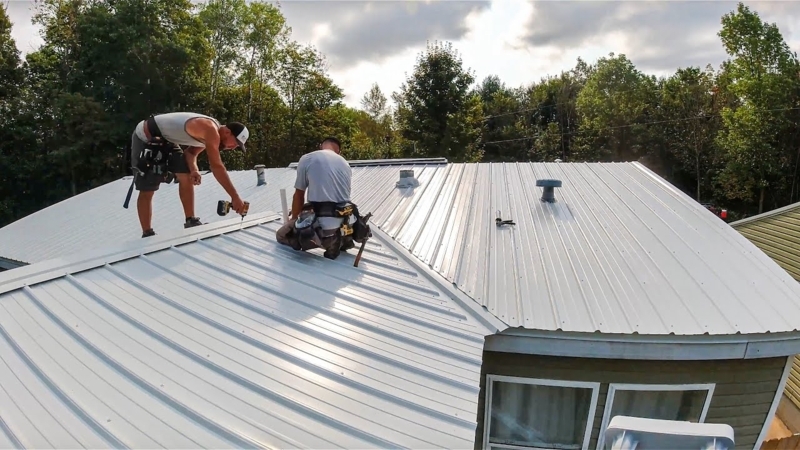 White Ribbed Metal Roof Installation with Exposed Fasteners