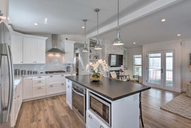 White Shaker Kitchen Cabinets with High-Contrast Dark Island Top