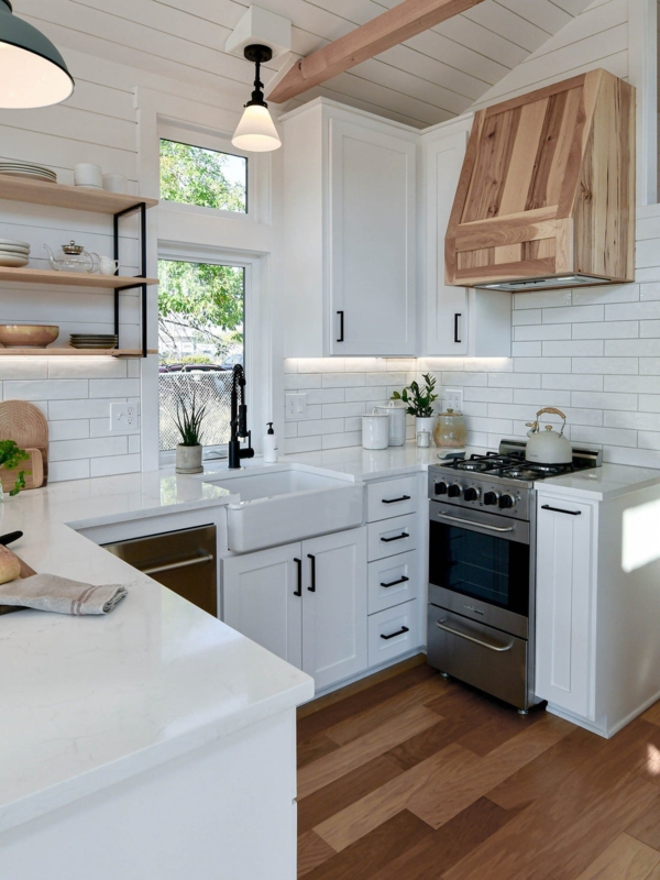 White Shiplap Kitchen with Wood Hood and Farmhouse Sink