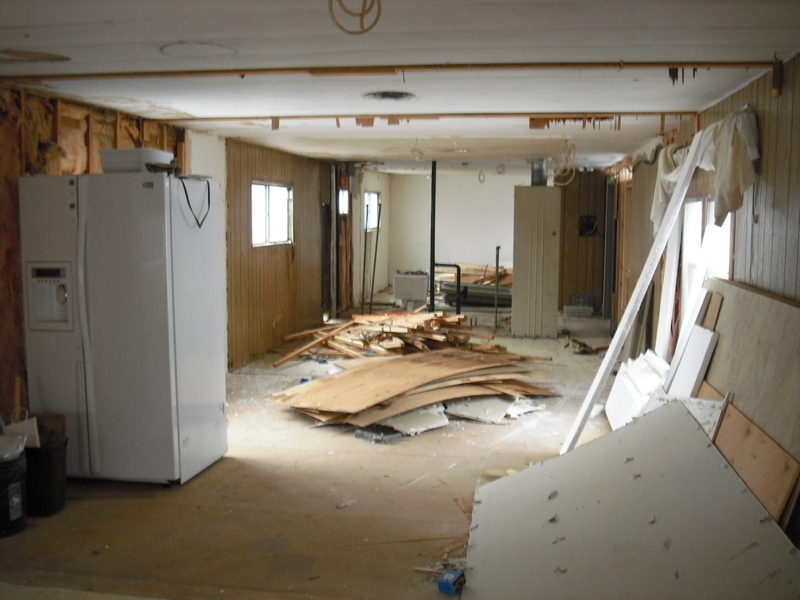 White Side-by-Side Refrigerator during an Older Mobile Home Remodel