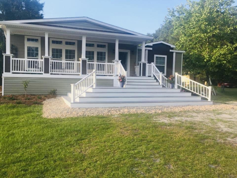 Wide Porch with Grand Entry Stairs & Sage Siding