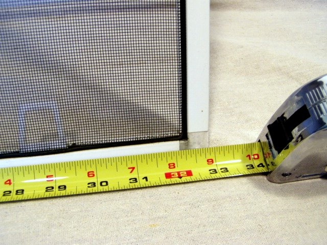 Window Screen Detail being Measured with Yellow Tape for Replacement