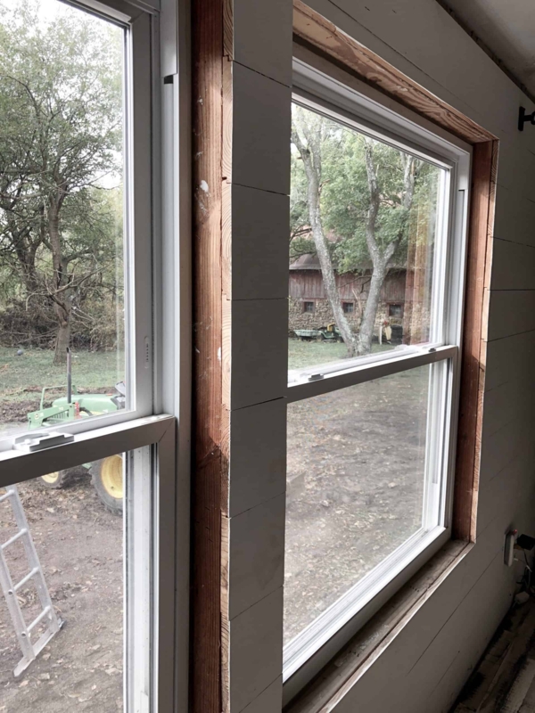 Window Unfinished Wood Trim on Side by Side Double Hung Sashes