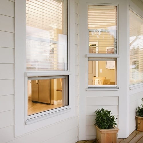 Windows with Integrated Retractable Screens and Thick White Trim