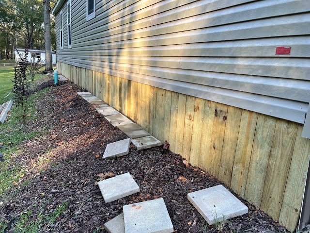 Wood Skirting: Vertical Treated Lumber with Mulch & Paver Border