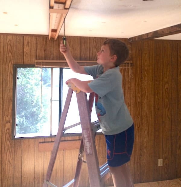 Wood Toned Paneling: Retro Interior with Ceiling Trim Renovation Project