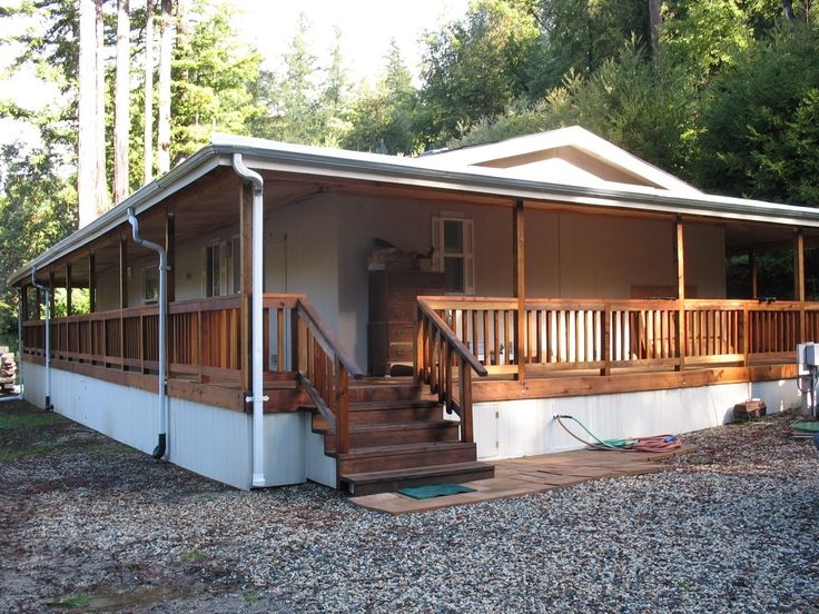 Wrap Around Porch with Integrated Roofline on White Manufactured Home