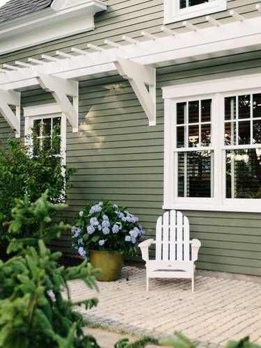 Adirondack Chair on Patio with Decorative Wall Pergola