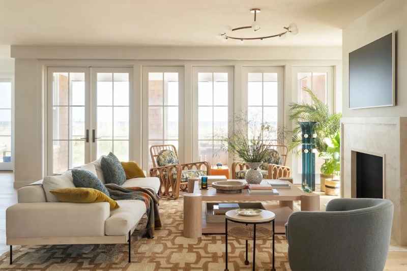 Airy Coastal Living Room French Doors & Rattan Armchairs