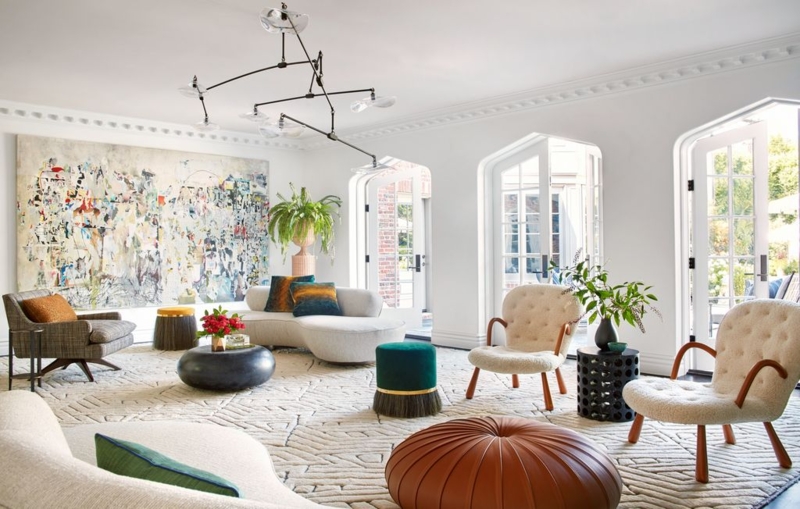 Airy Living Room with Curved Sofa Silhouette and Arched French Doors