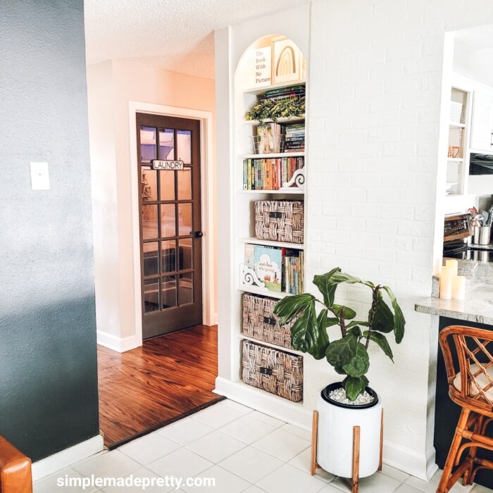 Arched Built-In Bookcase with White Painted Brick Wall