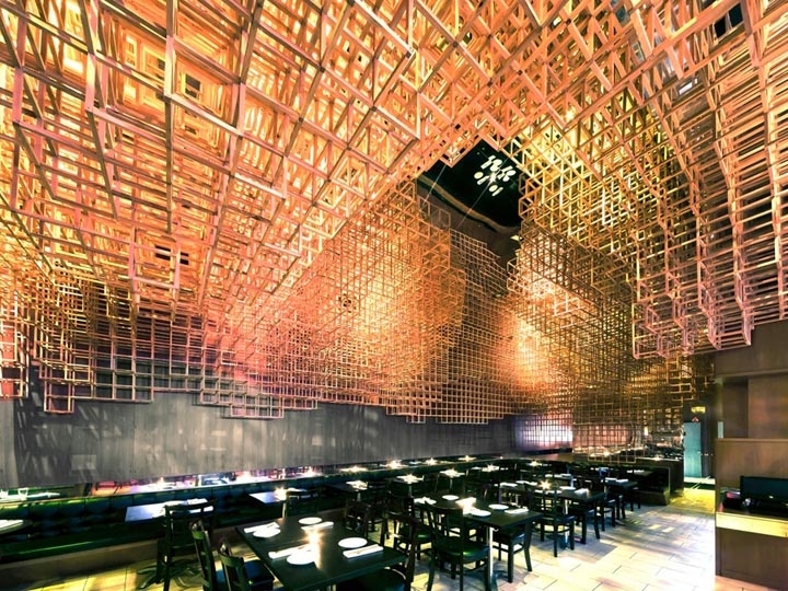 Avant-Garde Restaurant: Dramatic Geometric Ceiling & Warm Wood Grid