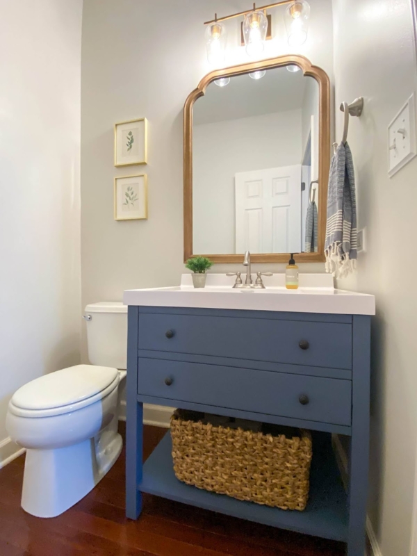 Bathroom Vanity Dusty Blue Cabinet Gold Arched Mirror Woven Basket