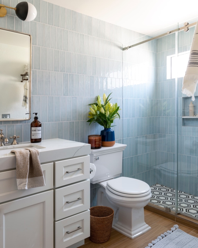 Bathroom with Vertical Stacked Tile, Geometric Shower Floor and Wicker