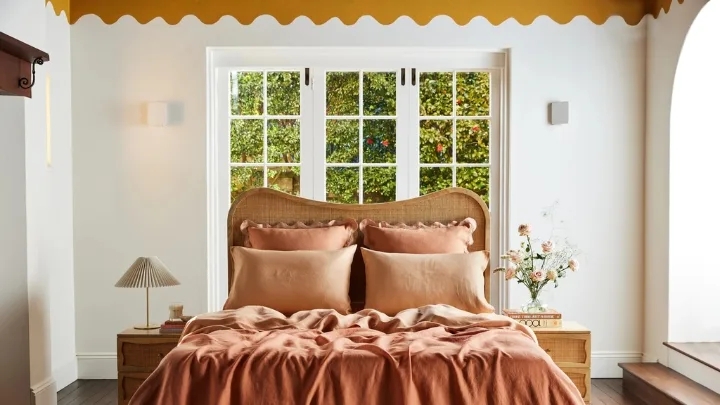 Bed with Rattan Headboard, Terracotta Linen and Scalloped Border