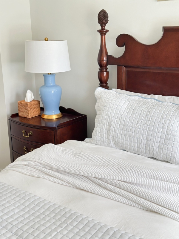Bedroom Vignette Dark Wood Bed Pineapple Finial Blue Ceramic Lamp