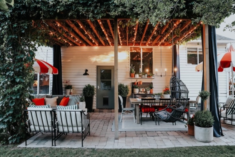 Bistro Style Patio under Ivy Covered Pergola with String Lights
