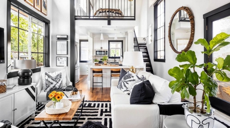 Black And White Loft Decor: Geometric Rug & Mezzanine View Living Room