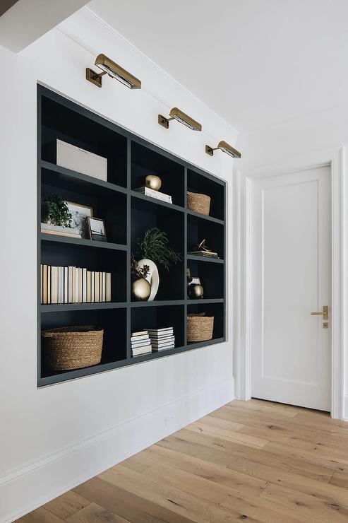 Black Built-In Grid Bookshelf with Brass Picture Lights